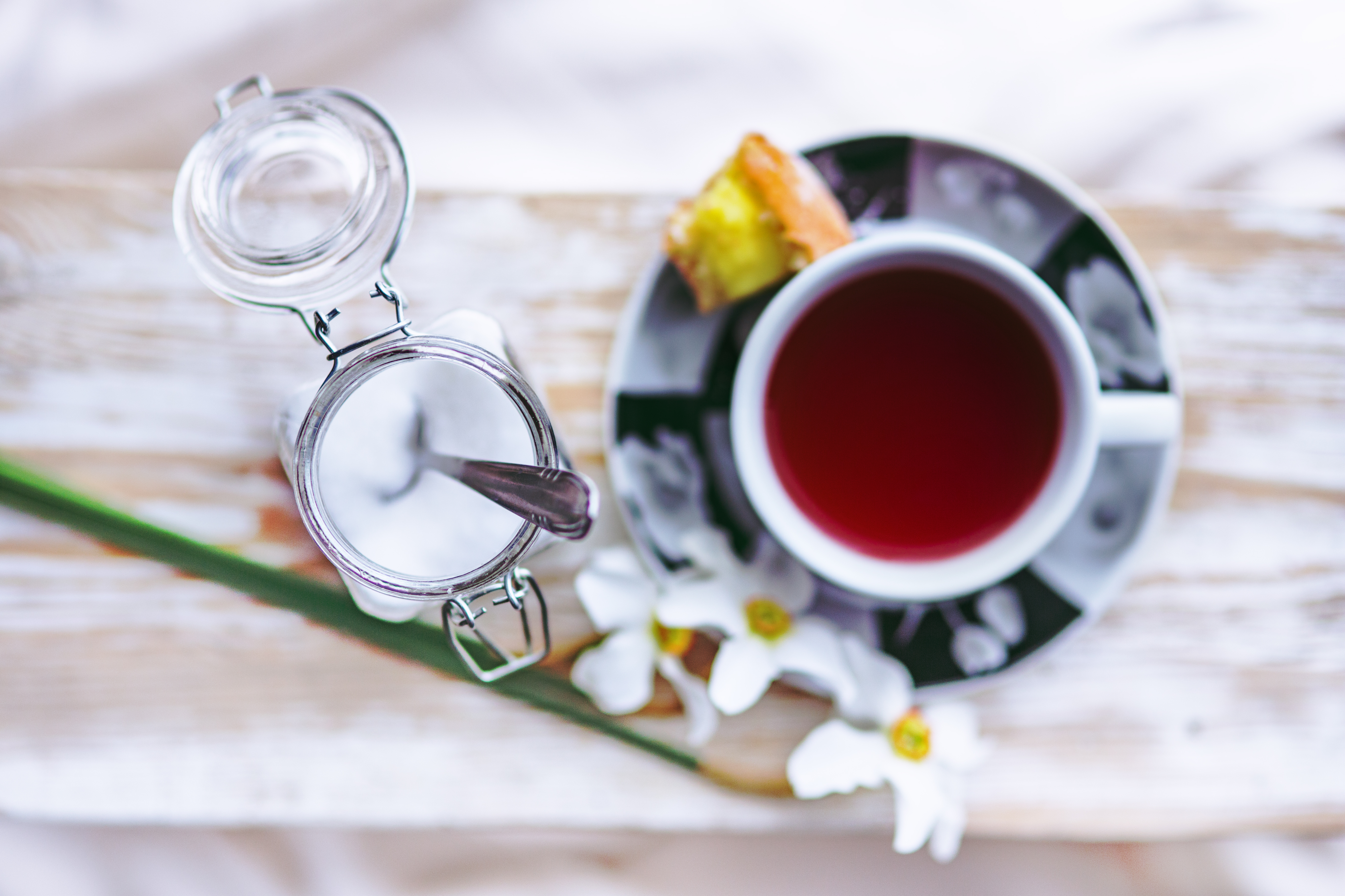 an arial view of tea and a jar of sugar